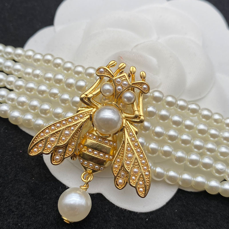Dior Bee Bracelet In Metal and White Resin Pearls Gold
